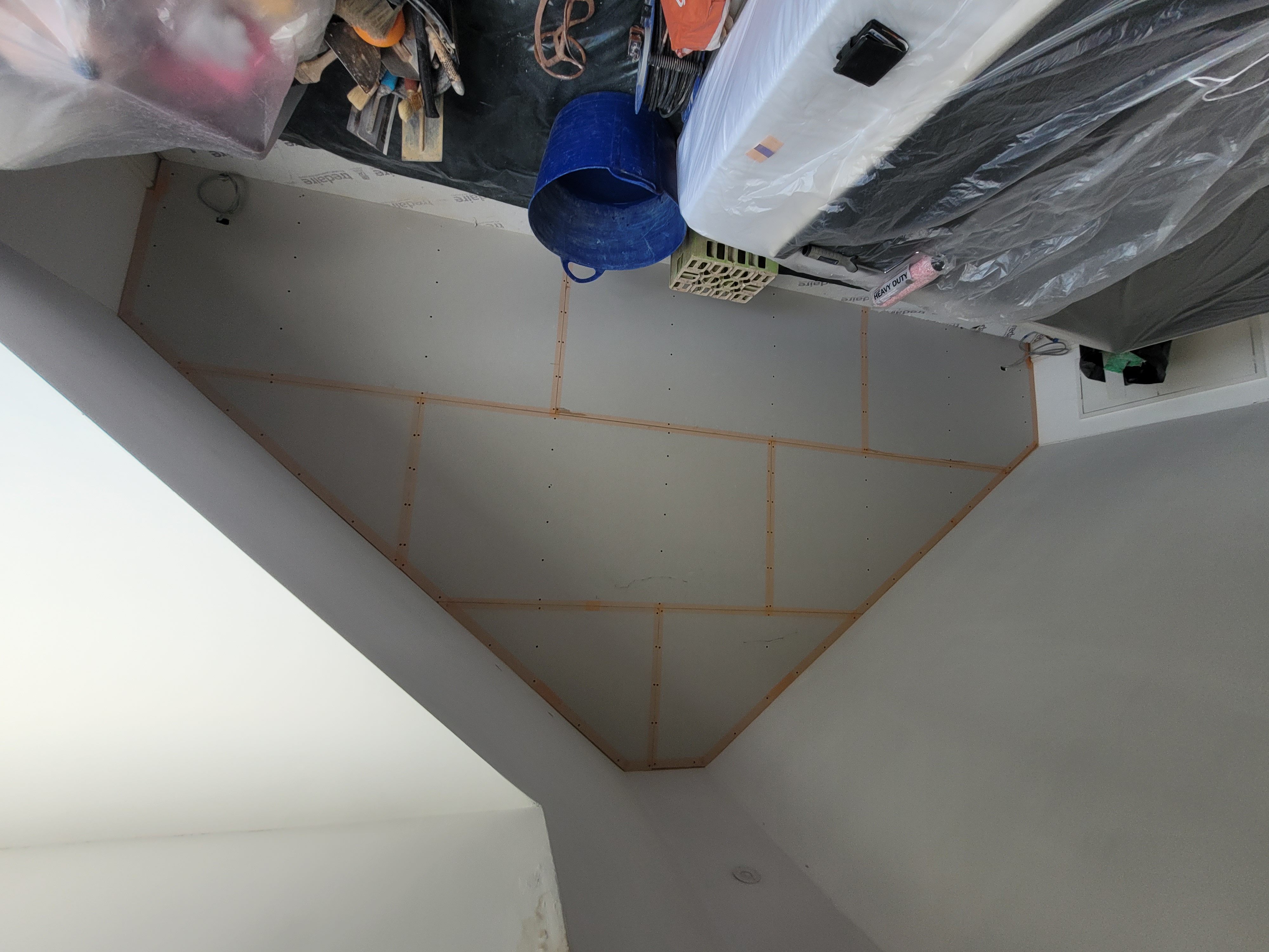 The plasterboard is now on the wall and ready to be prepped for plaster to go on.